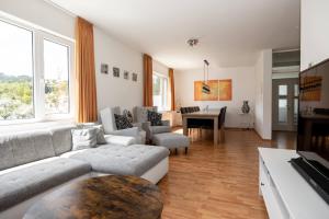 a living room with a couch and a table at Villa Ennert in Winterberg