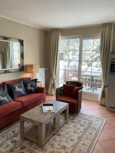 Posezení v ubytování Luxus Ferienwohnung Hirschzeit + 11 fotografií