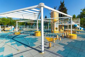 a water park with a playground with a slide at The Swing in Burgas