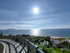 a view of the ocean from the balcony of a resort at Apec Mandala Mui Ne Phan Thiet in Ấp Long Sơn