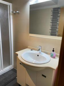 a bathroom with a sink and a shower at KAIROS HOME y garaje, Algemesi Home in Algemesí