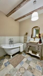 a bathroom with a tub and a sink and a mirror at Lo Exclusive Denia Els Poblets - Villa with private pool near to beach in Els Poblets +40 photos