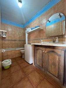 a bathroom with a sink and a toilet at Abades Chalet in La Listada