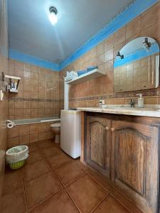 a bathroom with a sink and a toilet at Abades Chalet in La Listada
