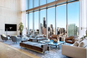 a living room with a view of a city at Blueground South Loop pool sports nr park CHI-1042 in Chicago