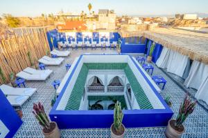 a swimming pool on the roof of a building at BÔ Riad Boutique Hotel & Spa in Marrakech