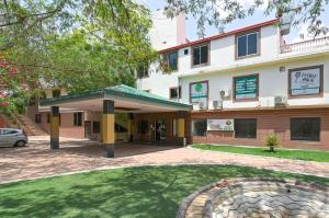 a view of the front of the building at The Byke Grassfield Resort with Outdoor Pool, Shyam Nagar, Jaipur in Jaipur