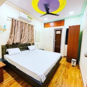 Postel nebo postele na pokoji v ubytování THE PALM UNITY HOME STAY