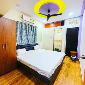 Postel nebo postele na pokoji v ubytování THE PALM UNITY HOME STAY