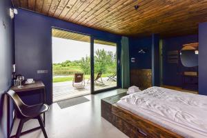 Cama ou camas em um quarto em Wakepond atostogų slėnis