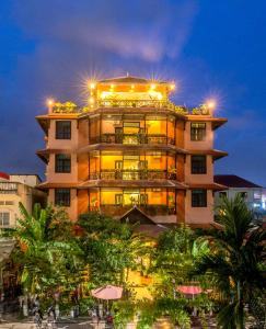 a tall building with lights on top of it at Angkor Panoramic Boutique Hotel in Siem Reap