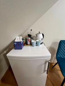 a table on top of a toilet in a room at Karlova Manor Apartments in Tartu