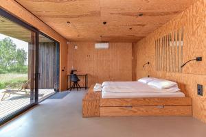 Cama ou camas em um quarto em Wakepond atostogų slėnis