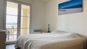 Postel nebo postele na pokoji v ubytování Appartement Les Oliviers L'ILE ROUSSE