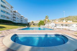 a swimming pool in the middle of a building at Romantic: Precioso frente al mar in Sitges