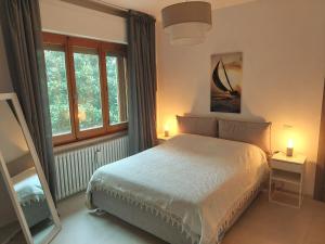 a bedroom with a bed and a window at Villa Bagno Santo in Sarteano +32 photos