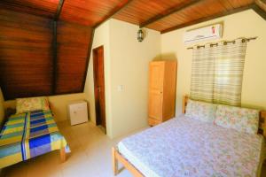 Cama ou camas em um quarto em Pousada Ecologica Bangalo de Praia