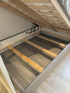 a bed frame with the bottom of a bunk bed at Vestfjordgata Apartment 12 in Svolvær