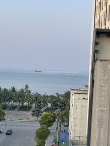 a view of the ocean from a building at Khách sạn Sơn Hiền Cửa Lò in Cửa Lò