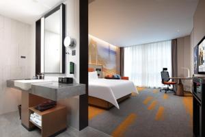 Letto o letti in una camera di Hampton by Hilton Guigang