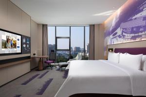 Postel nebo postele na pokoji v ubytování Hampton by Hilton Guigang + 27 fotografií