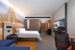 Letto o letti in una camera di Hampton by Hilton Guigang