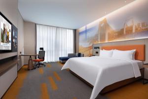 TV a/nebo společenská místnost v ubytování Hampton by Hilton Guigang