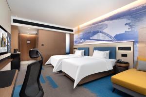 Letto o letti in una camera di Hampton by Hilton Guigang