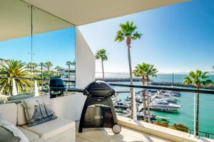 a living room with a view of a marina at Aqua Views in Cape Town