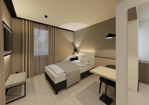 a hotel room with a bed and a table at Residenz Wessinger, Neu-Isenburg in Neu Isenburg
