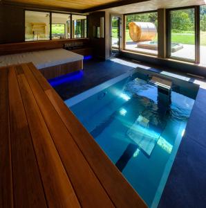 a pool in the middle of a house at Chalet Aikoa in Chamonix-Mont-Blanc