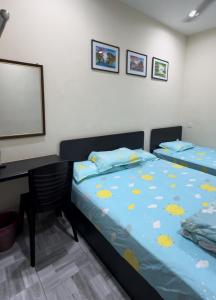 Postel nebo postele na pokoji v ubytování 西子楼 CZI Budget Hotel Sungai Siput