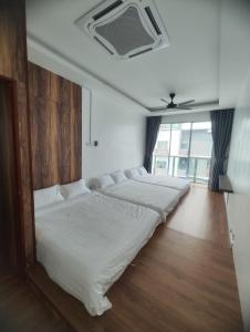 Katil atau katil-katil dalam bilik di 实耕庄双层海景公寓