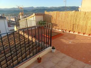 a balcony with a fence on top of a building at Hogar con encanto en Segorbe in Segorbe