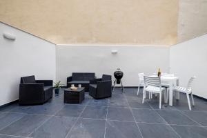 a room with chairs and a table and a table and chairs at Sliema 2BR Great Location with Terrace in Sliema