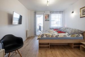 Televízia a/alebo spoločenská miestnosť v ubytovaní 27 Apart - Apartament Mieszkanie dla 2 osób