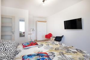 Televízia a/alebo spoločenská miestnosť v ubytovaní 27 Apart - Apartament Mieszkanie dla 2 osób