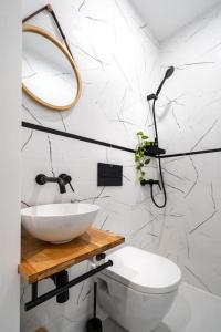 a bathroom with a sink and a toilet at NEW! High-street stylish flat (NDK) FREE Parking in Sofia