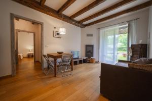 a living room with a table and a couch at Borgo Pianello Country Resort in Lizzano in Belvedere