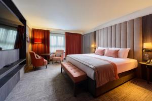 Ένα ή περισσότερα κρεβάτια σε δωμάτιο στο Hotel Killarney