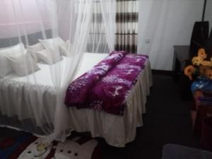 Postel nebo postele na pokoji v ubytování Green Haven Villa & Guest House