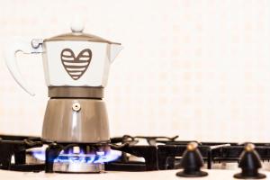 a coffee maker sitting on top of a stove at Dimora Iride in Monopoli