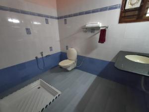Koupelna v ubytování Ashtamudi Homes