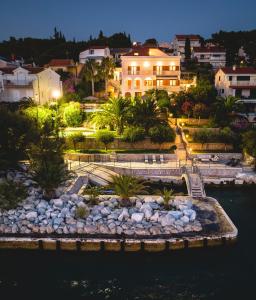 a view of a resort with a river and buildings at Luxury Sunset Villa Trogir Private Beach in Okrug Donji