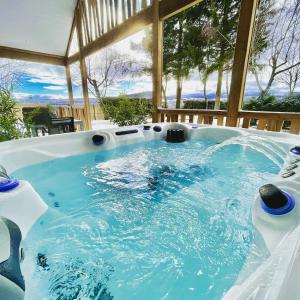 a large jacuzzi tub in a house at Domaine les 2 Mondes in Aydat