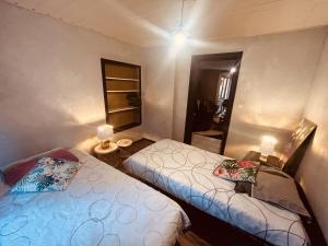 a small room with two beds and a mirror at LA MARIEFACTURE - Comme c'est Jungle in Hombourg-Haut +7 photos