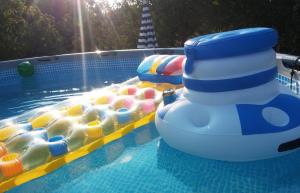 a inflatable pool with a bunch of balls in it at Apartments and Rooms Minex in Trebinje