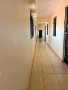 an empty hallway in an office building at Exquisite Modern suite 1bedroom in Busia