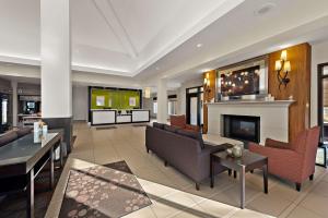 a living room with a couch and a fireplace at Hilton Garden Inn Findlay in Findlay