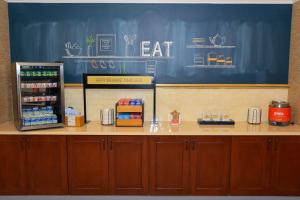 a counter in a fast food restaurant with a refrigerator at Hampton Inn Atlanta-Canton in Canton